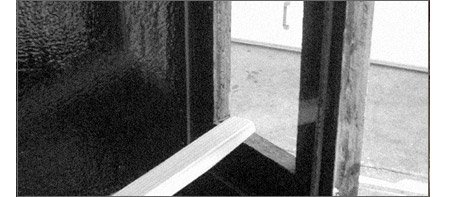 Aquarium window being sealed into place 1953